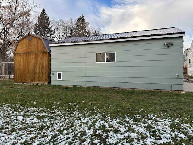 exterior space with a lawn and an outdoor structure