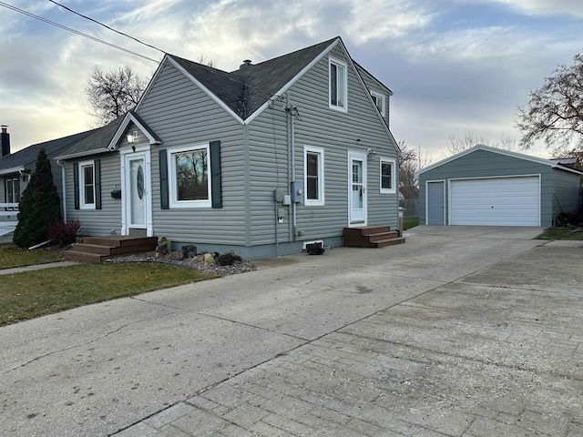 view of front facade featuring a garage and an outdoor structure