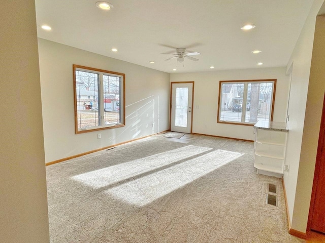 interior space featuring ceiling fan