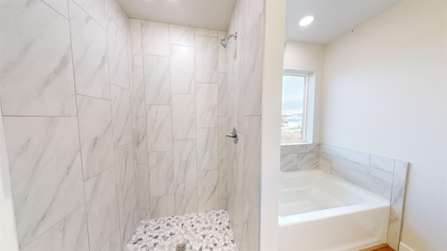 bathroom with shower with separate bathtub