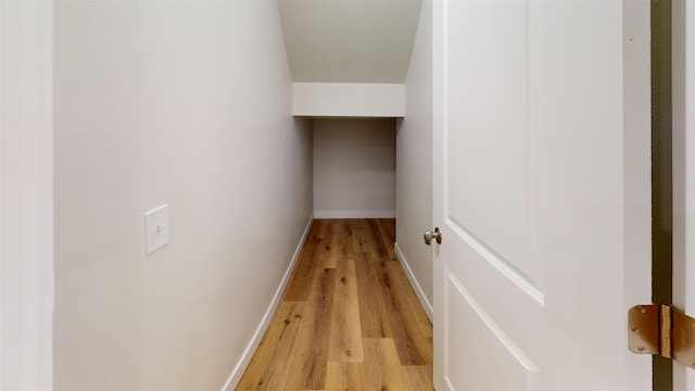 corridor with light wood-type flooring