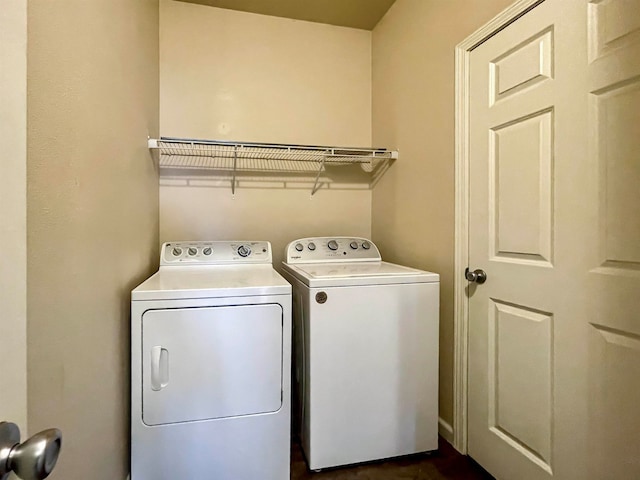 clothes washing area featuring independent washer and dryer