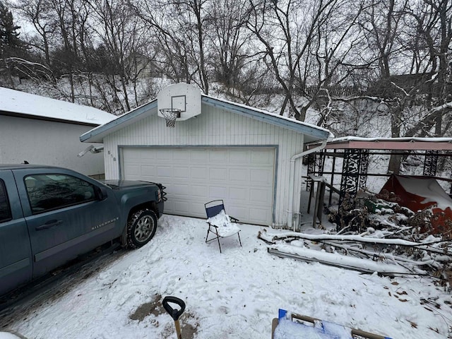 view of snow covered garage