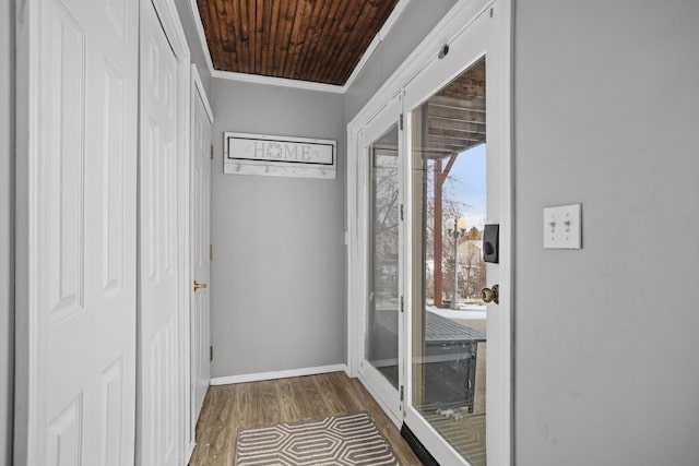 entryway with crown molding, wood ceiling, and dark hardwood / wood-style floors