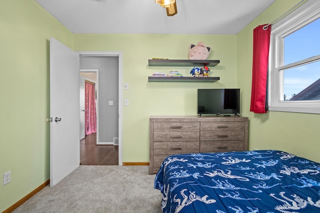 carpeted bedroom with ceiling fan