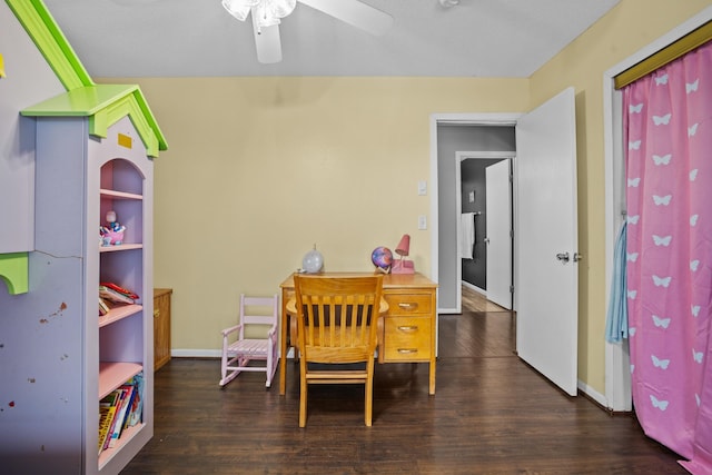 interior space featuring ceiling fan and dark wood-type flooring