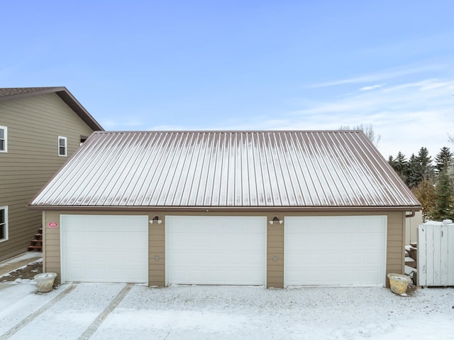 view of snow covered garage