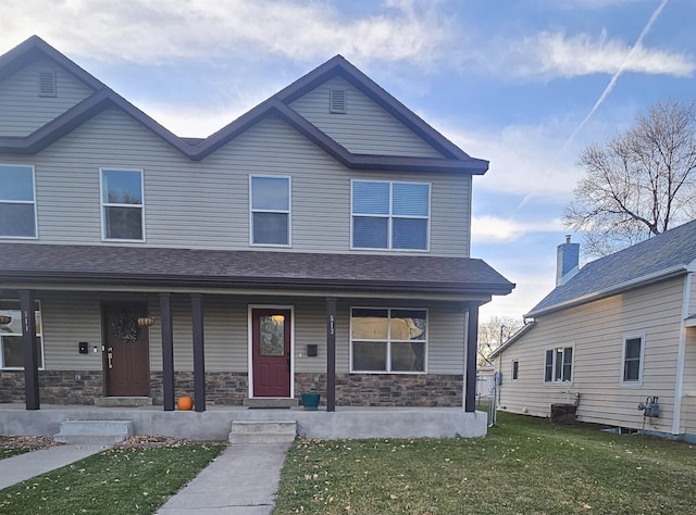 view of front of house featuring a porch and a front lawn