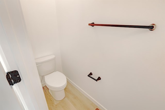 3308 23rd Ave NW, Minot, ND 58703 - bathroom with hardwood / wood-style floors and toilet