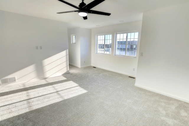 3308 23rd Ave NW, Minot, ND 58703 - unfurnished room with light colored carpet and ceiling fan