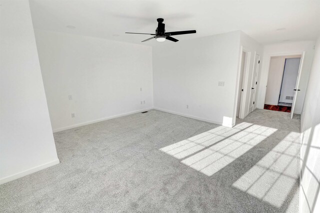 3308 23rd Ave NW, Minot, ND 58703 - carpeted empty room with ceiling fan