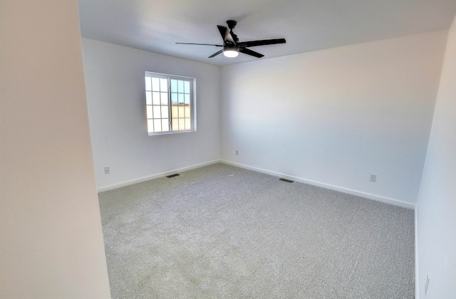 3308 23rd Ave NW, Minot, ND 58703 - carpeted empty room featuring ceiling fan