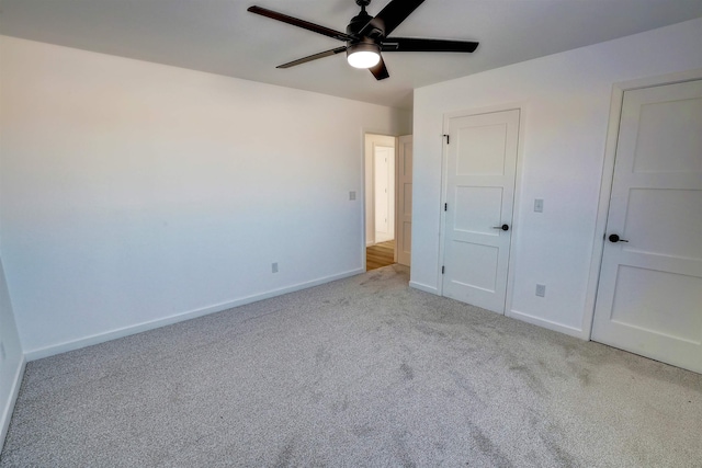 3308 23rd Ave NW, Minot, ND 58703 - unfurnished bedroom with ceiling fan and light carpet