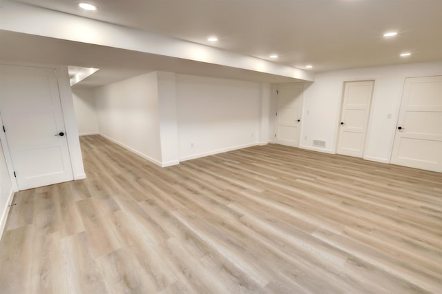 3308 23rd Ave NW, Minot, ND 58703 - basement featuring light hardwood / wood-style floors