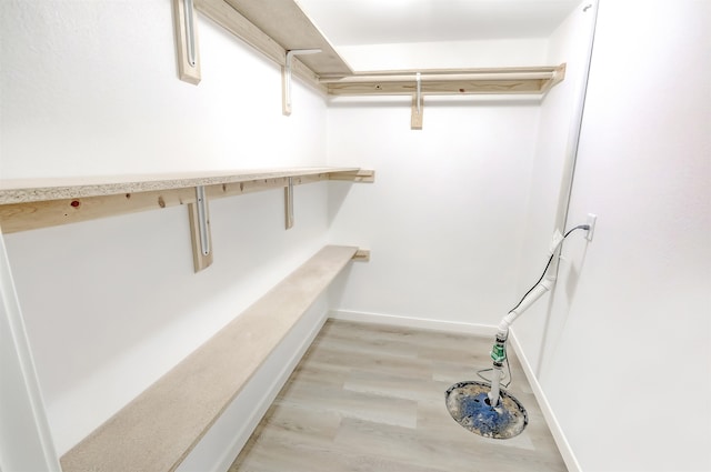 3308 23rd Ave NW, Minot, ND 58703 - spacious closet featuring light hardwood / wood-style floors