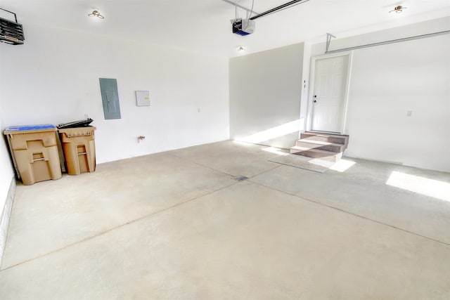 3308 23rd Ave NW, Minot, ND 58703 - garage with electric panel and a garage door opener