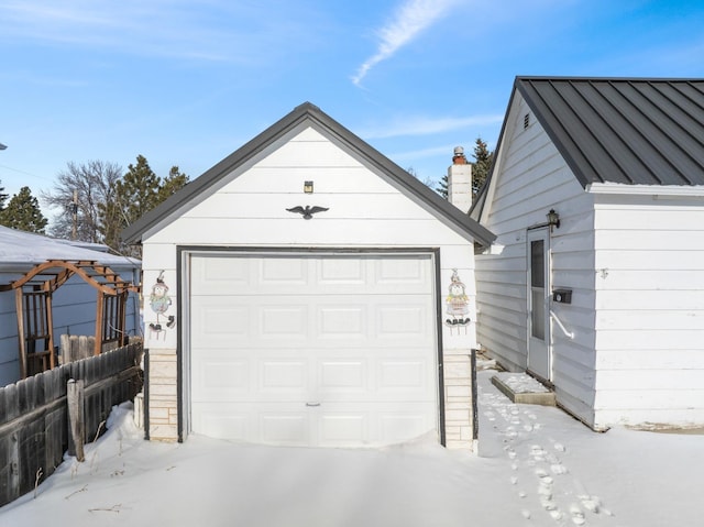 view of snow covered garage