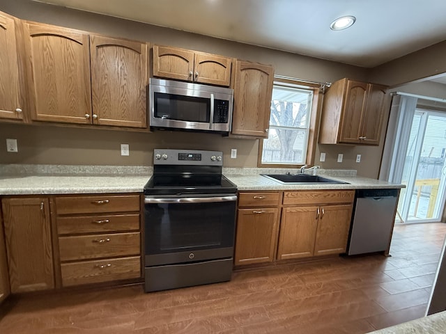 kitchen featuring hardwood / wood-style floors, sink, and stainless steel appliances