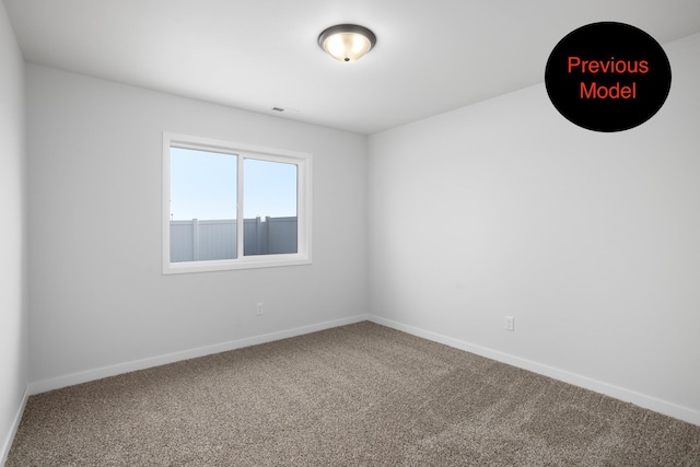 unfurnished room featuring carpet