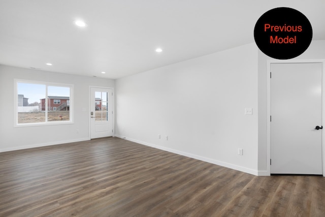 spare room with dark wood-type flooring