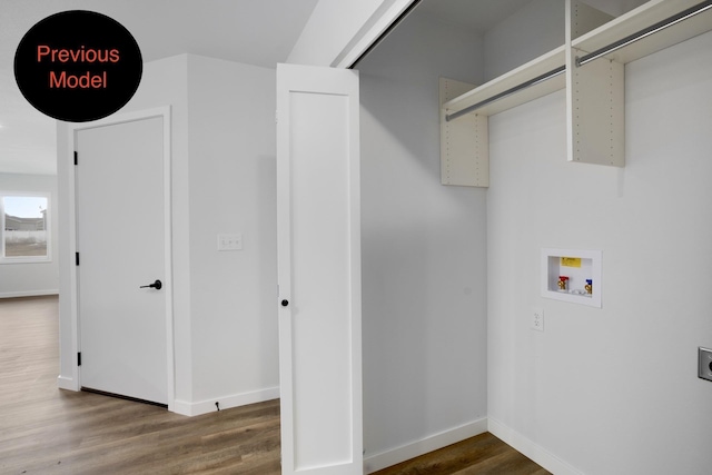 washroom featuring hookup for a washing machine and dark hardwood / wood-style flooring