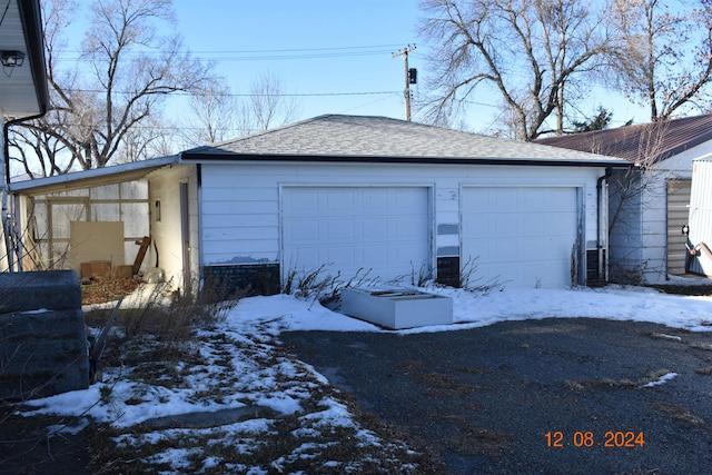 view of snow covered garage