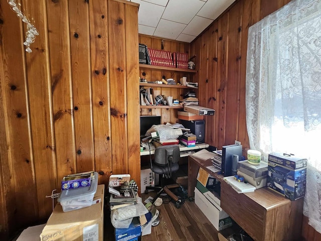 office space featuring dark hardwood / wood-style flooring and wooden walls