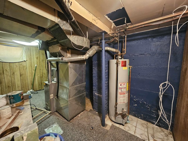 utility room featuring heating unit and water heater