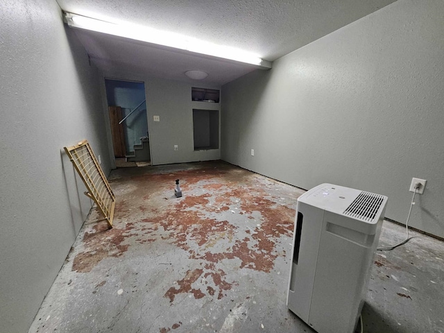 empty room with a textured ceiling