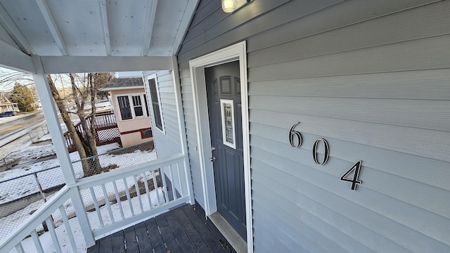 view of snow covered property entrance