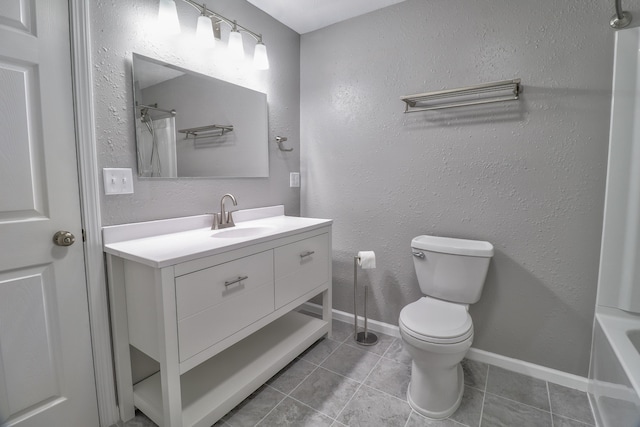 bathroom with tile patterned floors, vanity, and toilet