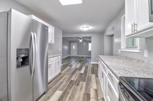 kitchen with white cabinets, ceiling fan, dark wood-type flooring, and appliances with stainless steel finishes