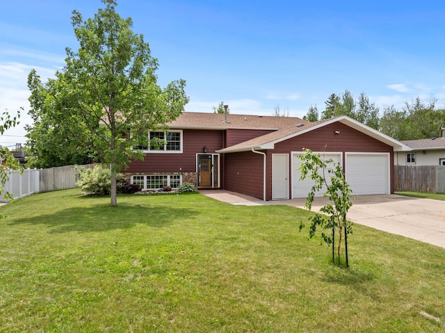 view of front facade featuring a garage and a front lawn