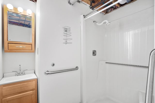 bathroom featuring vanity and walk in shower