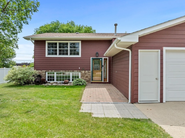 entrance to property featuring a lawn