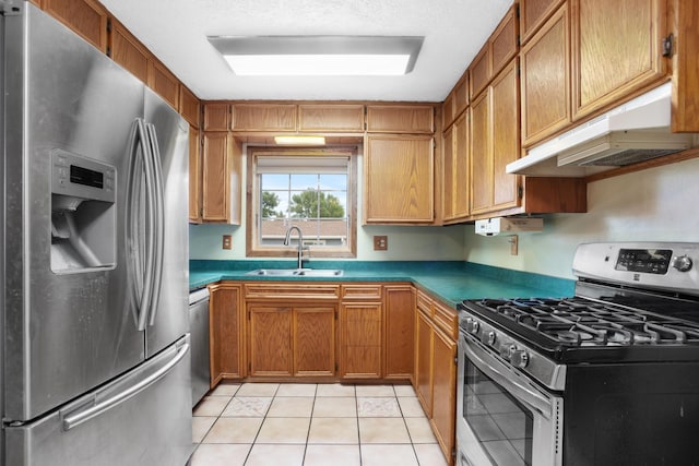 kitchen featuring light tile patterned flooring, sink, and appliances with stainless steel finishes