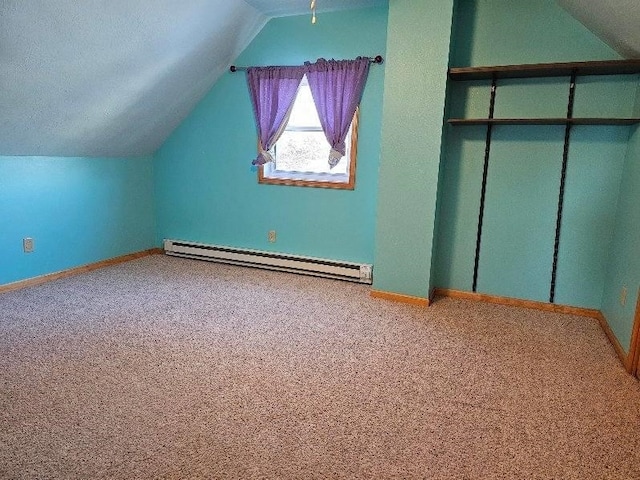 bonus room featuring carpet flooring, a textured ceiling, lofted ceiling, and a baseboard heating unit