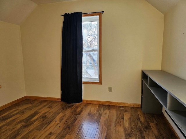 bonus room with lofted ceiling and dark wood-type flooring