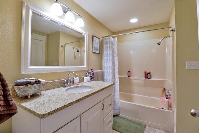 bathroom featuring vanity and shower / tub combo with curtain