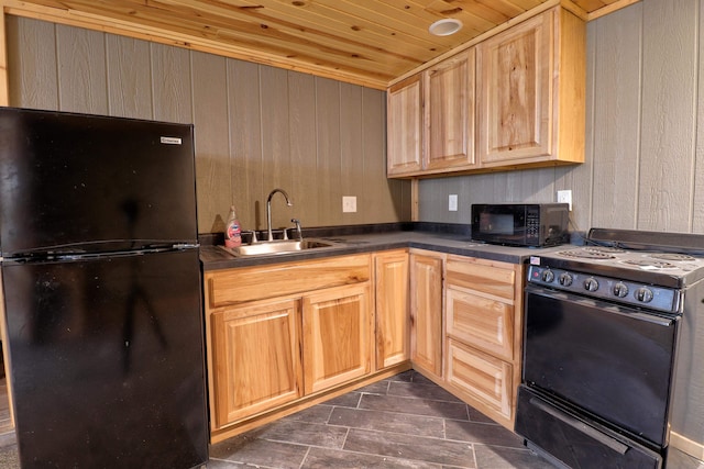 kitchen featuring light brown cabinets, black appliances, sink, wooden walls, and wood ceiling