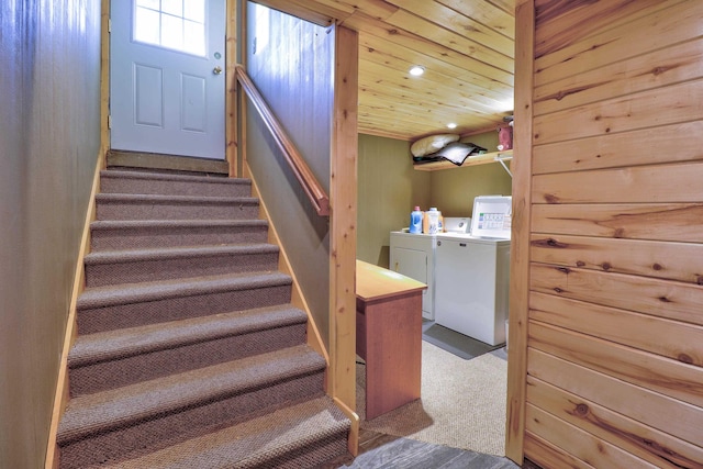 stairway featuring carpet flooring and independent washer and dryer