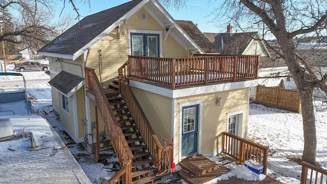 view of snow covered house