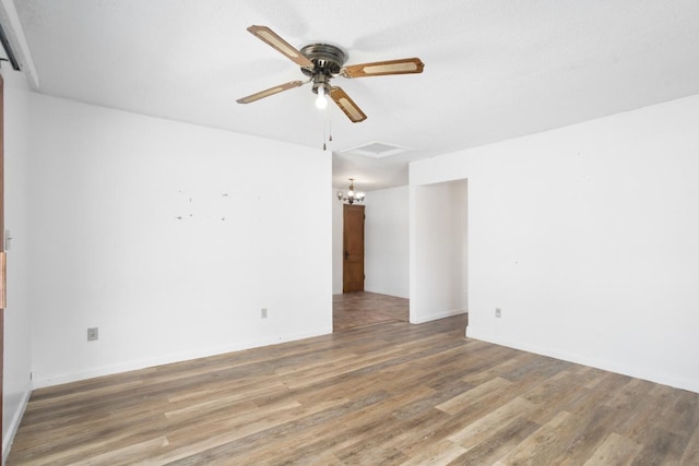 empty room with ceiling fan and wood-type flooring