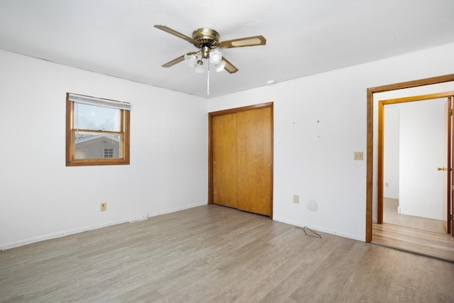 unfurnished room featuring ceiling fan and light hardwood / wood-style flooring