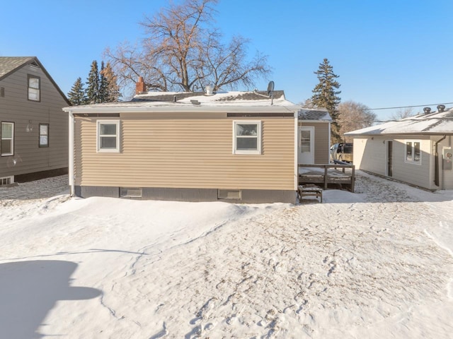 view of snow covered house