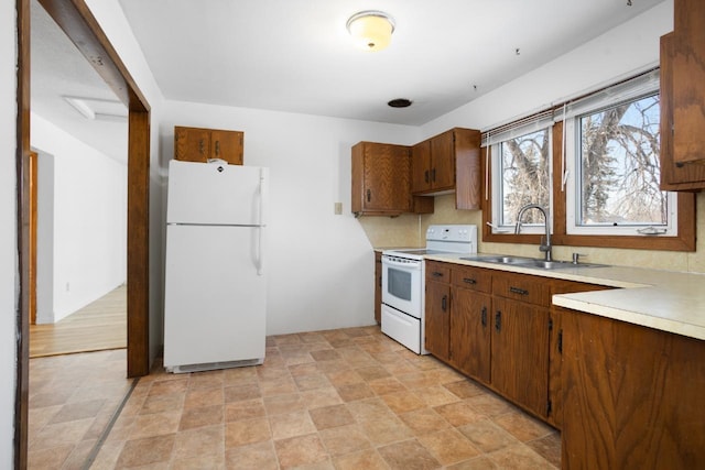 kitchen with sink and white appliances