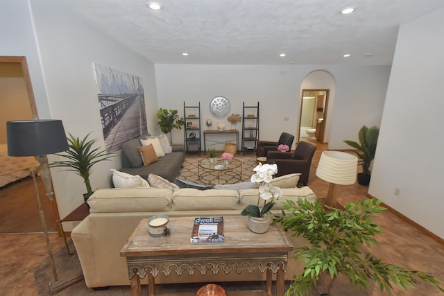 living room featuring a textured ceiling