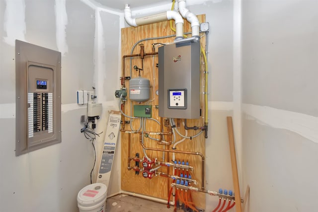 utility room with tankless water heater and electric panel