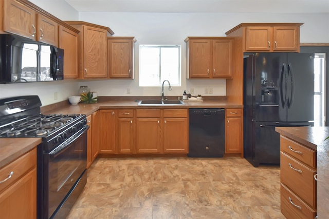 kitchen featuring black appliances and sink