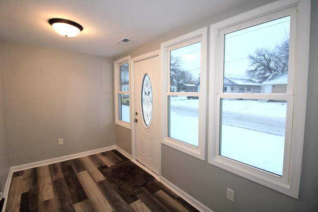 doorway with dark hardwood / wood-style floors